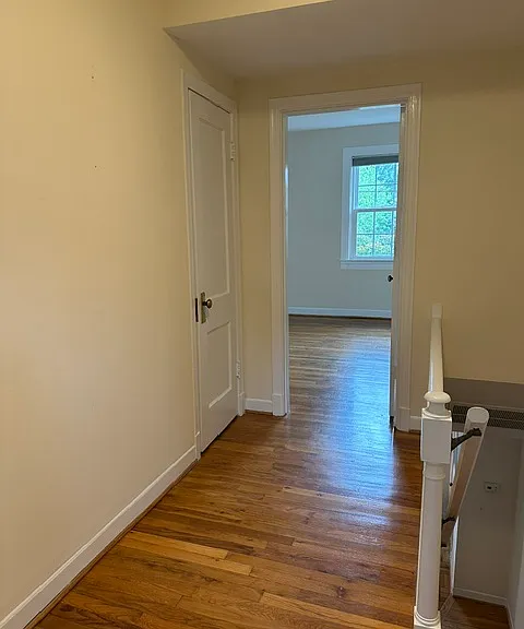 Upper landing opens to primary bedroom and bathroom