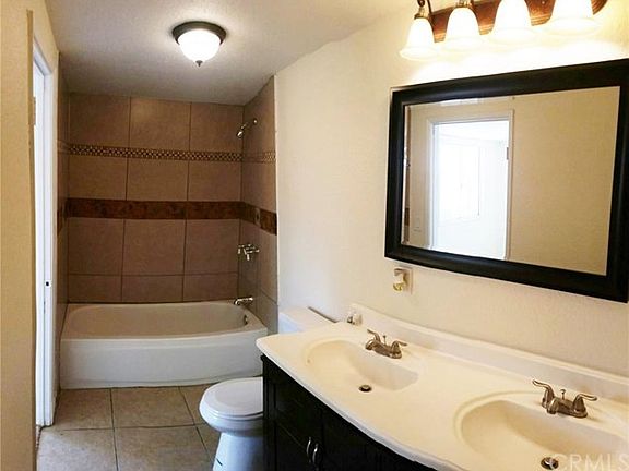 Large remodeled bathroom with dual vanity