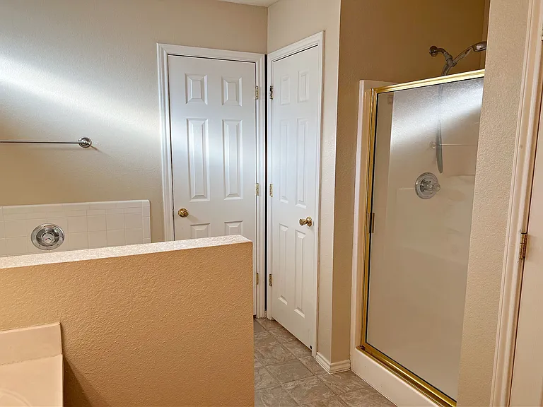 Master bath separate doors for shower, toilet & linen closet