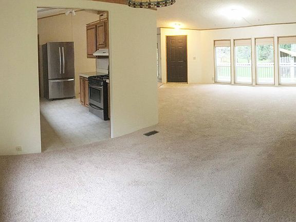 Dining room with views of the kitchen and living room