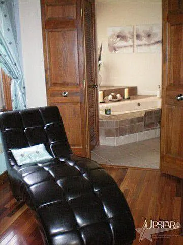 The master bedroom is so large there is plenty of room for a reading nook or exercise equipment.