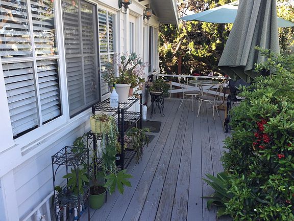 Front entrance with deck and propane BBQ.