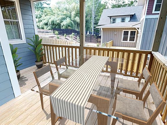 Large covered front porch. Big enough for outdoor dining. (Furniture is virtually staged and does not come with the property.)