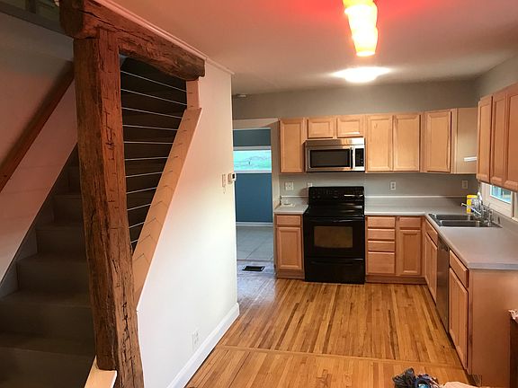 Totally remodeled Kitchen. Note custom woodwork on stairs! S