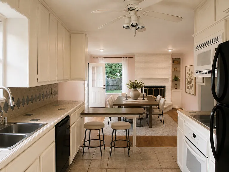 View into dining room from the kitchen. Island can be used for additional seating.