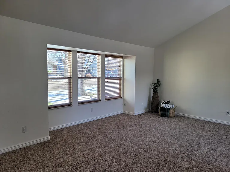 Living room with vaulted ceilings