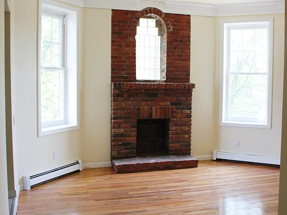 Formal dining room with brick fireplace accent