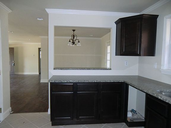 Left side of kitchen showcasing the granite countertops