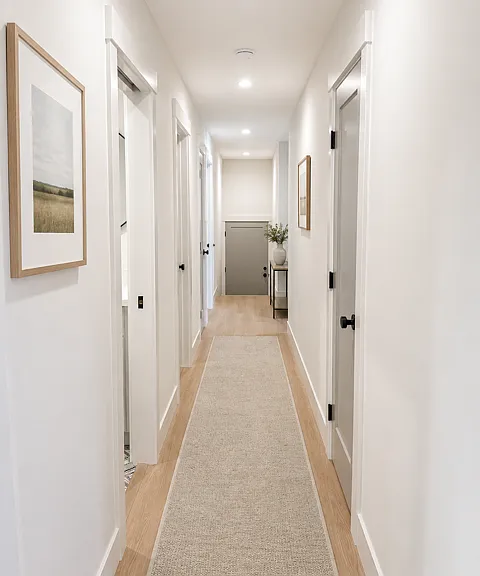Large hall for easy access to bedrooms, bathrooms, laundry, and garage.
