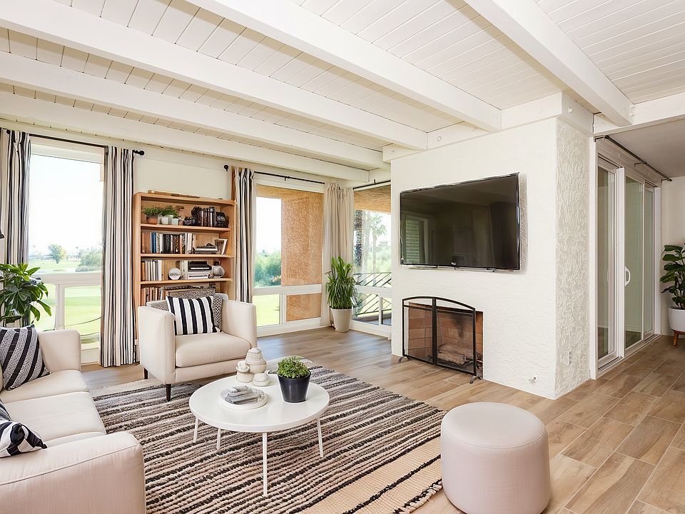 Living room with golf course views and fireplace