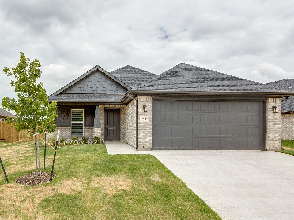 Neat front view featuring a double garage for parking or storage.