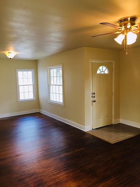 Entry into living and dinning area. Original hardwood!
