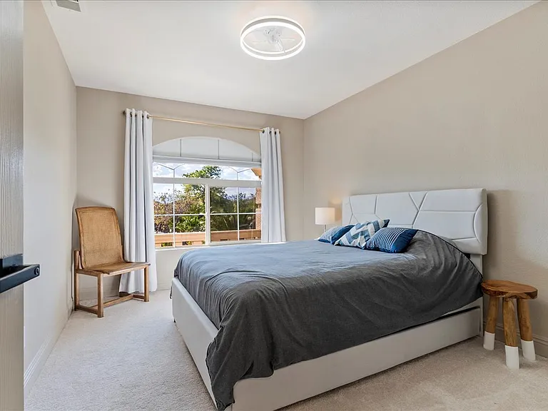 Bedroom 2 with queen bed and pull out single trundle beds