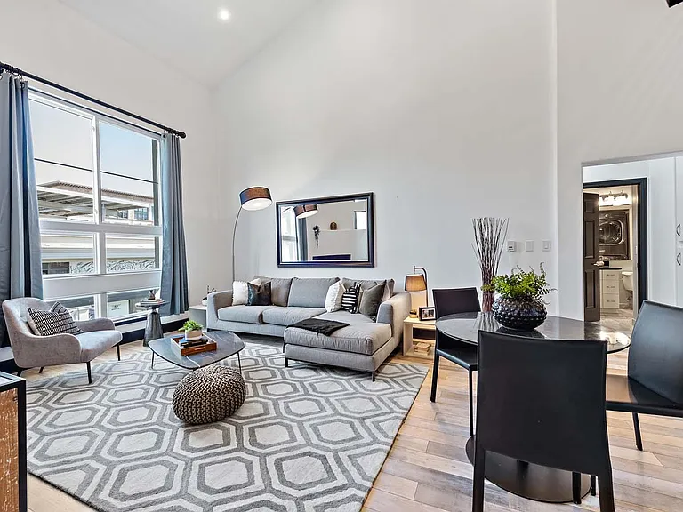 View of living room facing 2nd bedroom and shared bathroom