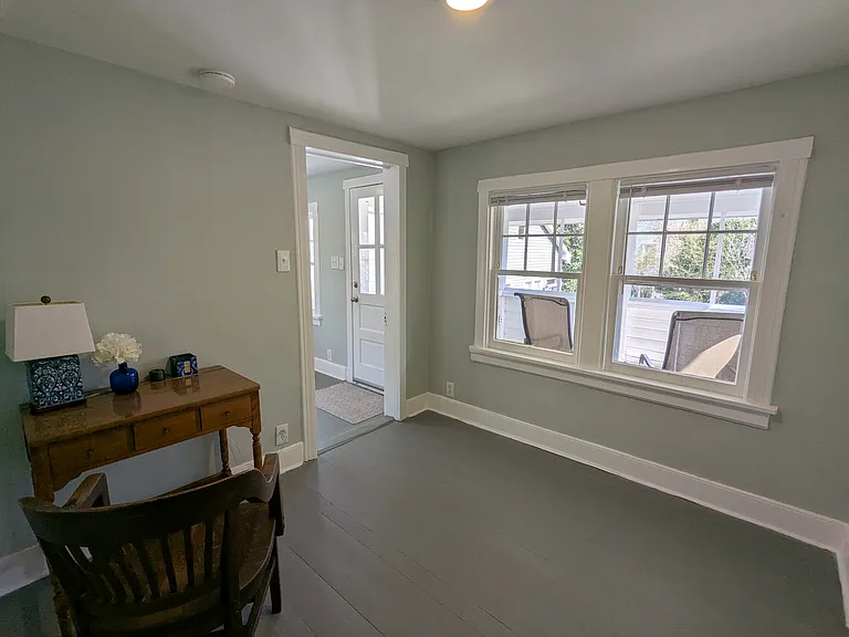 Upstairs bedroom looking out onto screened porch.