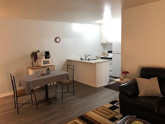 Fully-stocked kitchen and dining area.