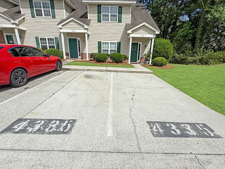 Two dedicated numbered parking spaces right in front of the townhome