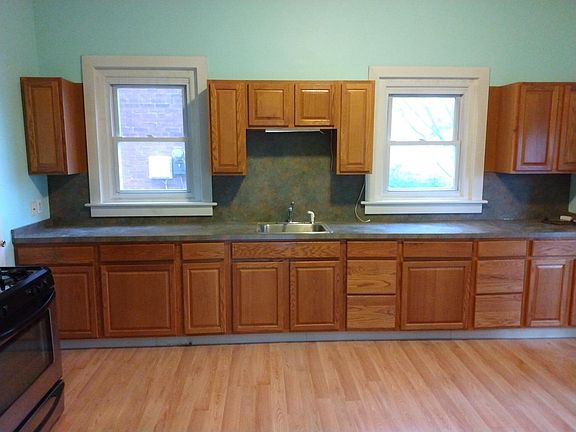 Eat in kitchen with tons of cabinets and countertop