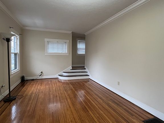 Living room leading to stairs