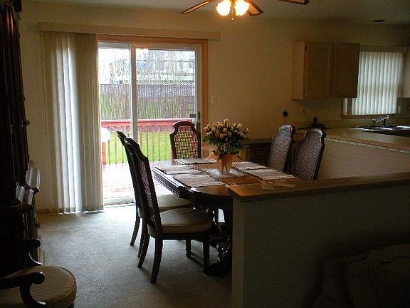 dining area looking out sliding glass door to rear deck