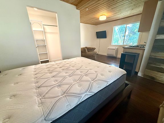 Open studio layout featuring designated sleeping area, family room, and walk-in closet