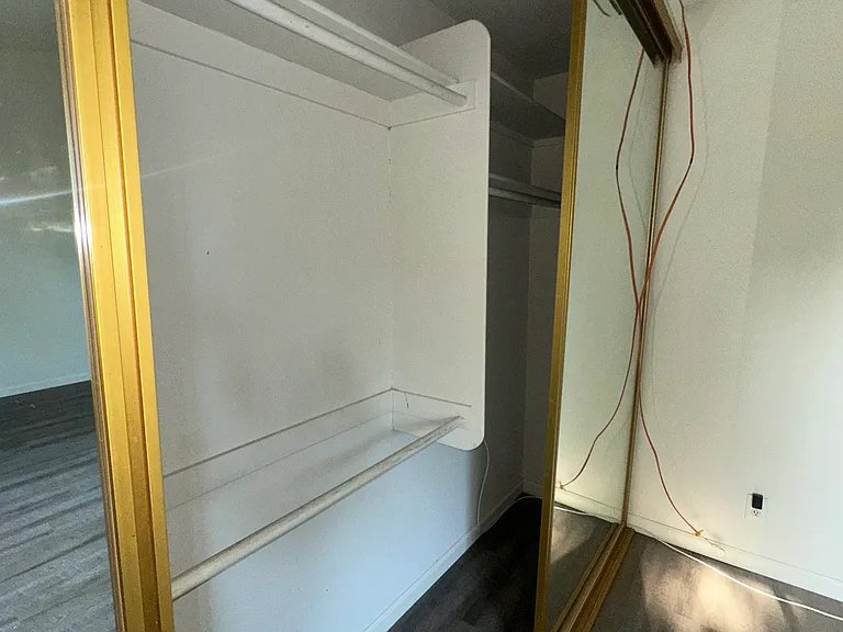 main bedroom closet with built in organization