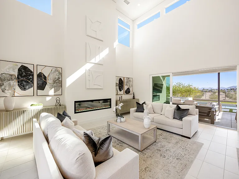 This home has a spacious great room with high ceilings and lots of natural lighting. The room is perfect for entertaining guests or just relaxing with family.