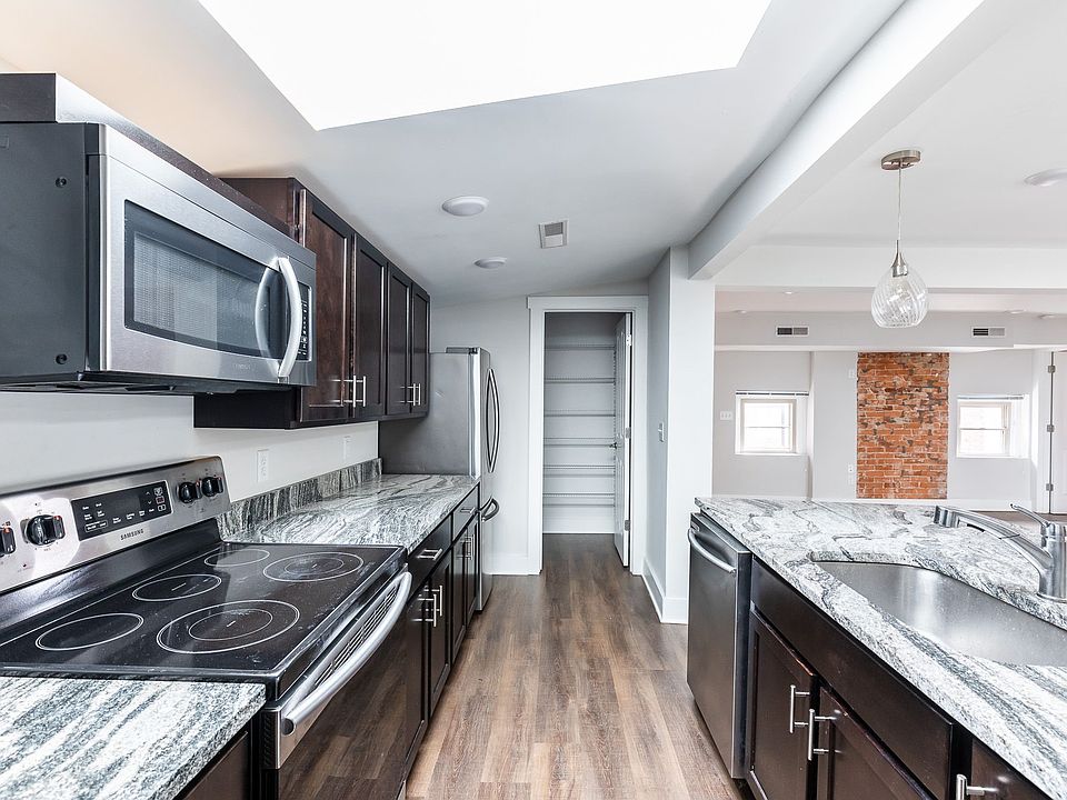 Spacious kitchen with counter bar.