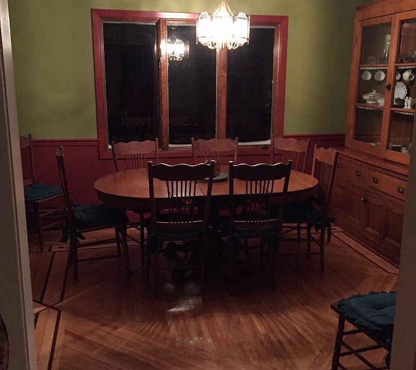 Dining Room area with custom hardwood flooring with doorway to kitchen, living room and garage enty