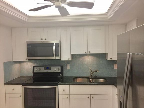 Brand new cabinets, tile backsplash, granite countertops, stainless steel appliances and trayed ceiling.