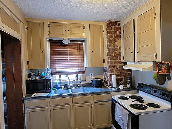 Love exposed brick in kitchen