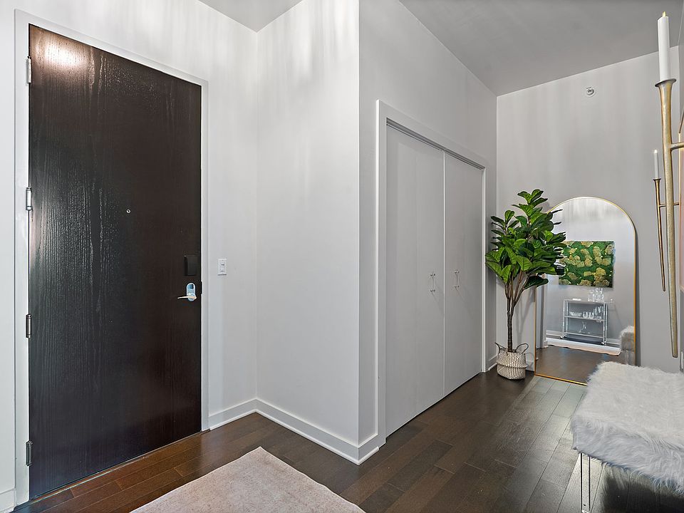 Entry hall with laundry center in closet.