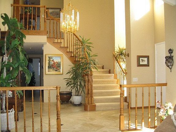 Curved staircase with exquisite Travertine flooring