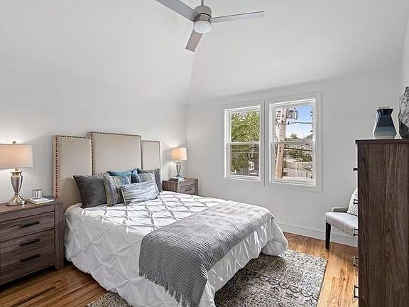 Primary bedroom with high roof, big window, walk-in closet, central air AC. There is also a fan for people who don't like AC.