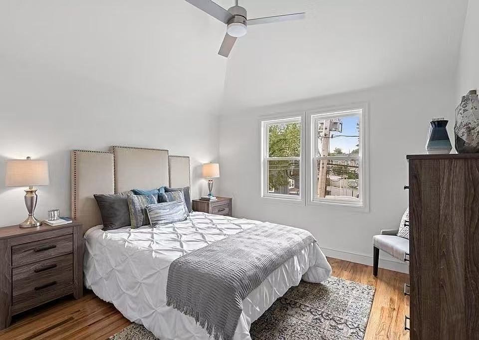 Primary bedroom with high roof, big window, walk-in closet, central air AC. There is also a fan for people who don't like AC.