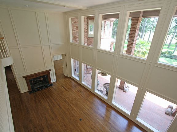 View from the balcony showing the pool and golf course views. Notice the firep