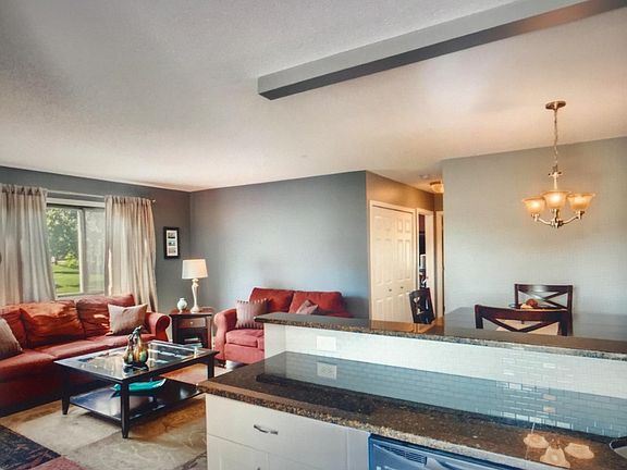 Kitchen opens into living room and dining room