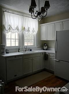 Kitchen : Door leads to Sun Porch. Walk-in pantry and Butler's Pantry not pictured.