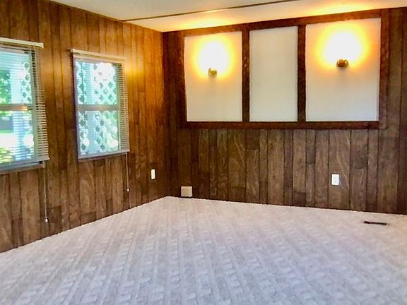 Open concept living room. Plenty of windows with built-in screens.