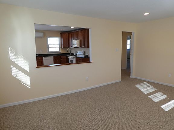 Entrance to the living room and view of the kitchen