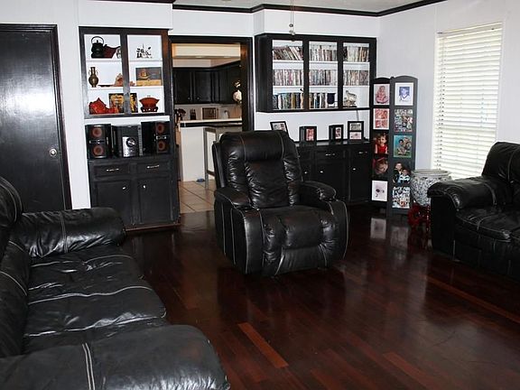Another look at the Den shows the built-ins on both sides of the doorway leading to Kitchen