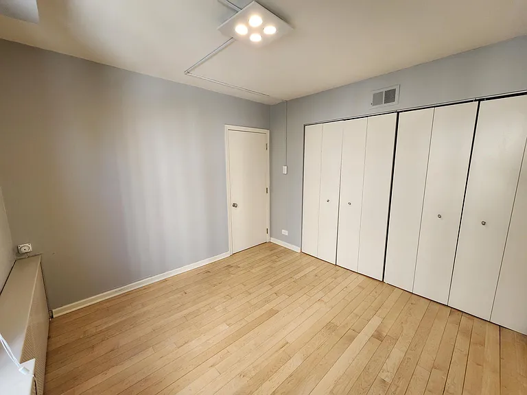 Second bedroom. The room has two entrances, one to the hallway next to second bath and another into the living room.