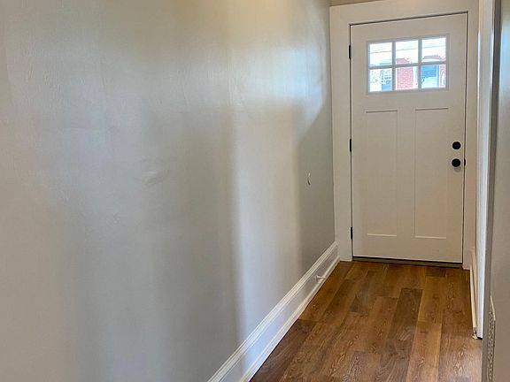 Front door leading to porch and hallway