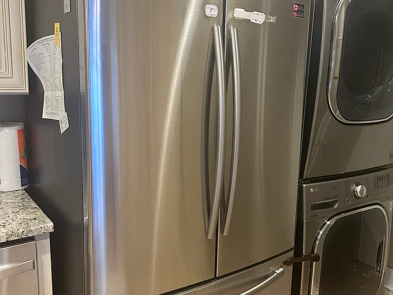 Fridge, washer and dryer in the kitchen