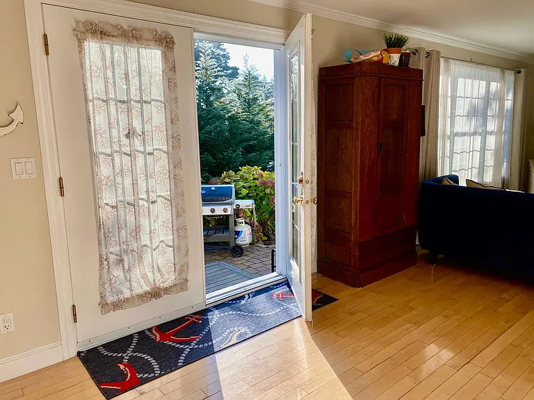 These French doors open to a beautiful private patio area.