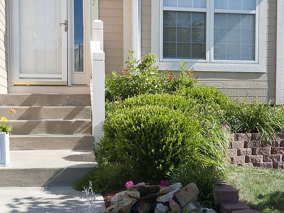 Lush professional landscaping & a fountain greet you at the front door!