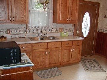 Kitchen features new cabinets and countertops plus flooring