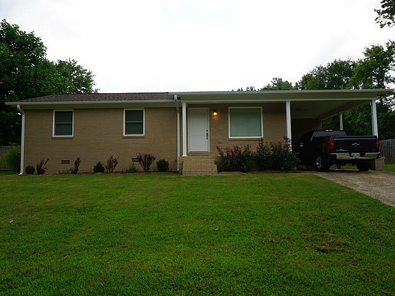 Exterior has black shutters