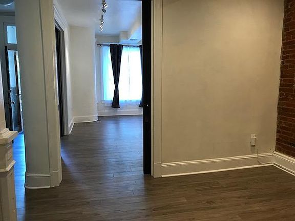 View of first living room from second living room. First living room can be closed off using the pocket door.