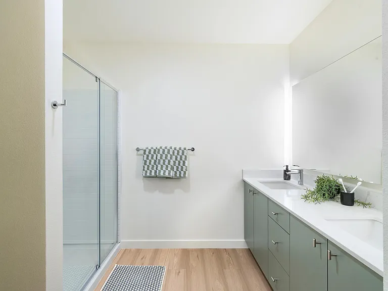 Step into the expansive shower for a refreshing start to your day.